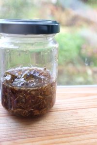 Macerating herbs in oil by the sun method